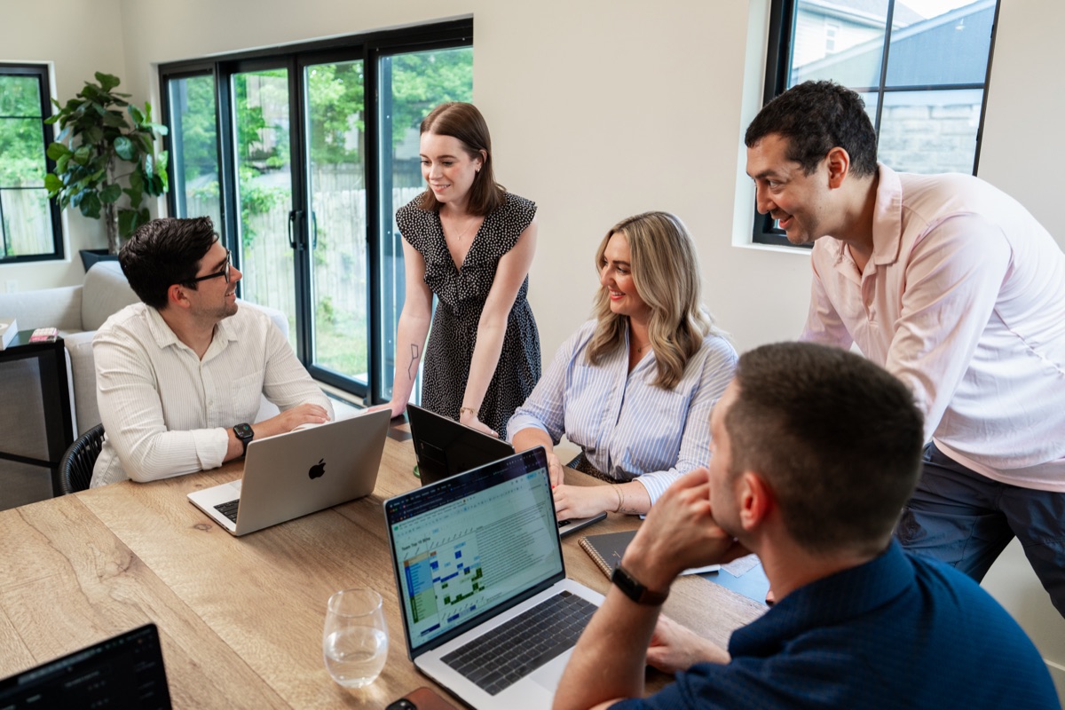 Colleagues reviewing work together on screen